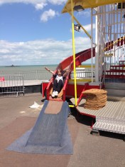 George enjoying the Helter Skelter. In the background you can ee the end of the old pier.